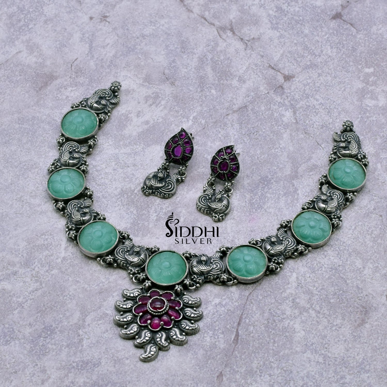 trendy silver necklace design with blue carving stone.