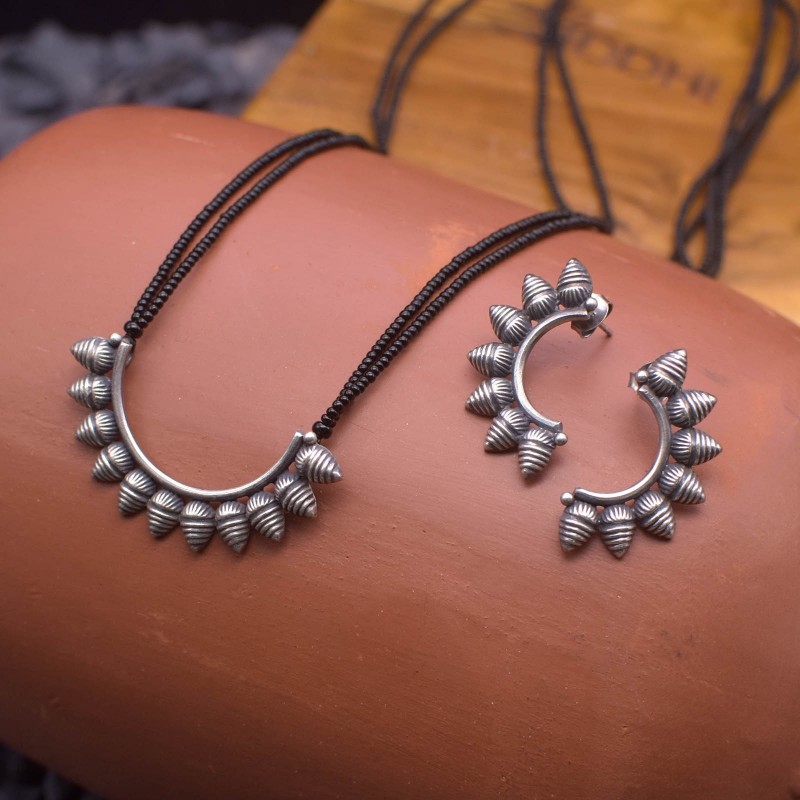 silver pendant and matching earrings