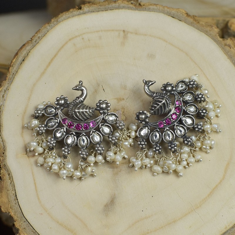 silver peacock earrings with red stone
