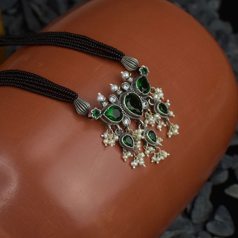 silver tanmani pendant with green stones