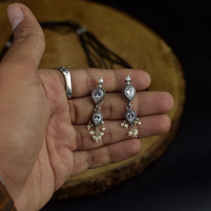 silver tanmani earrings with white stones