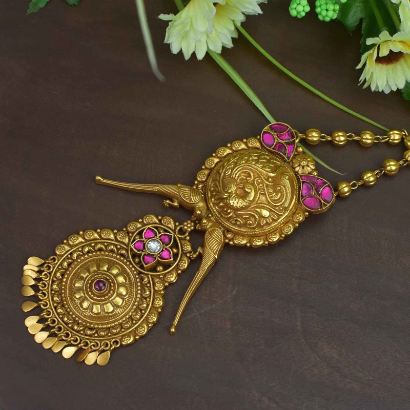 gold plated silver pendant studded with kundan pieces.