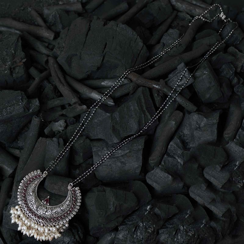 silver long mangalsutra design with hand made silver pendant.