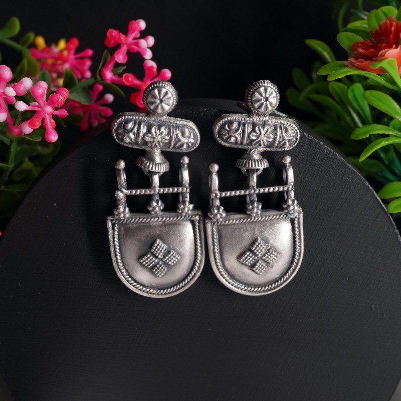 Silver tribal jhumkas with ethnic design