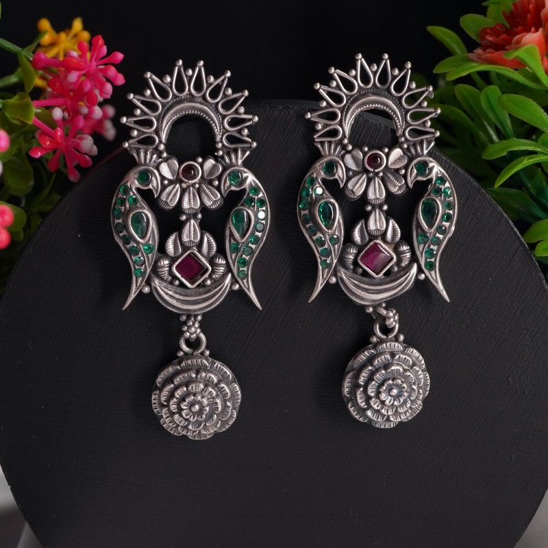 Silver peacock stud earrings with green stones