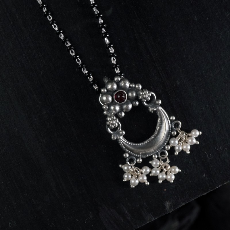 simple silver chandrakor pendant
