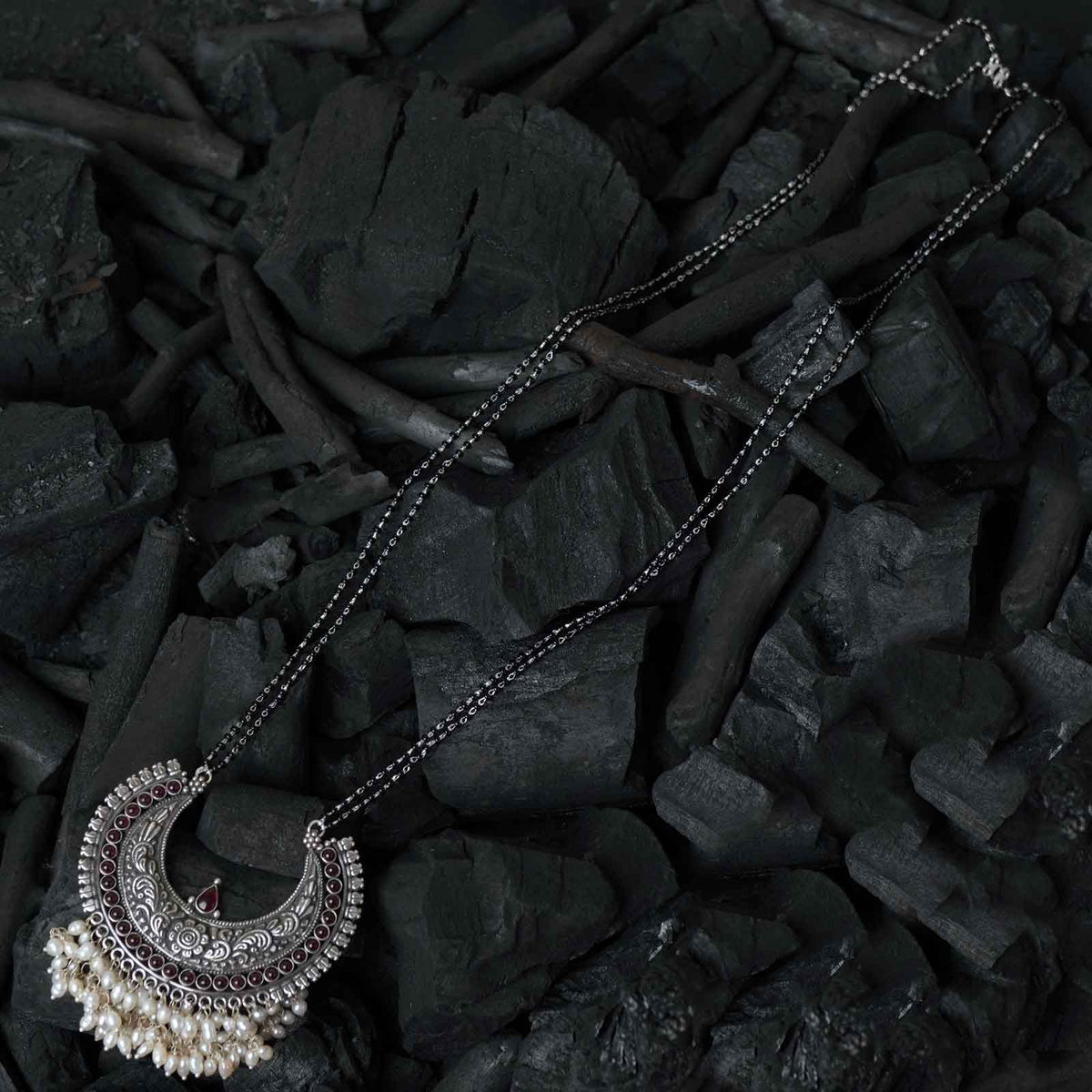 silver long mangalsutra design with hand made silver pendant.