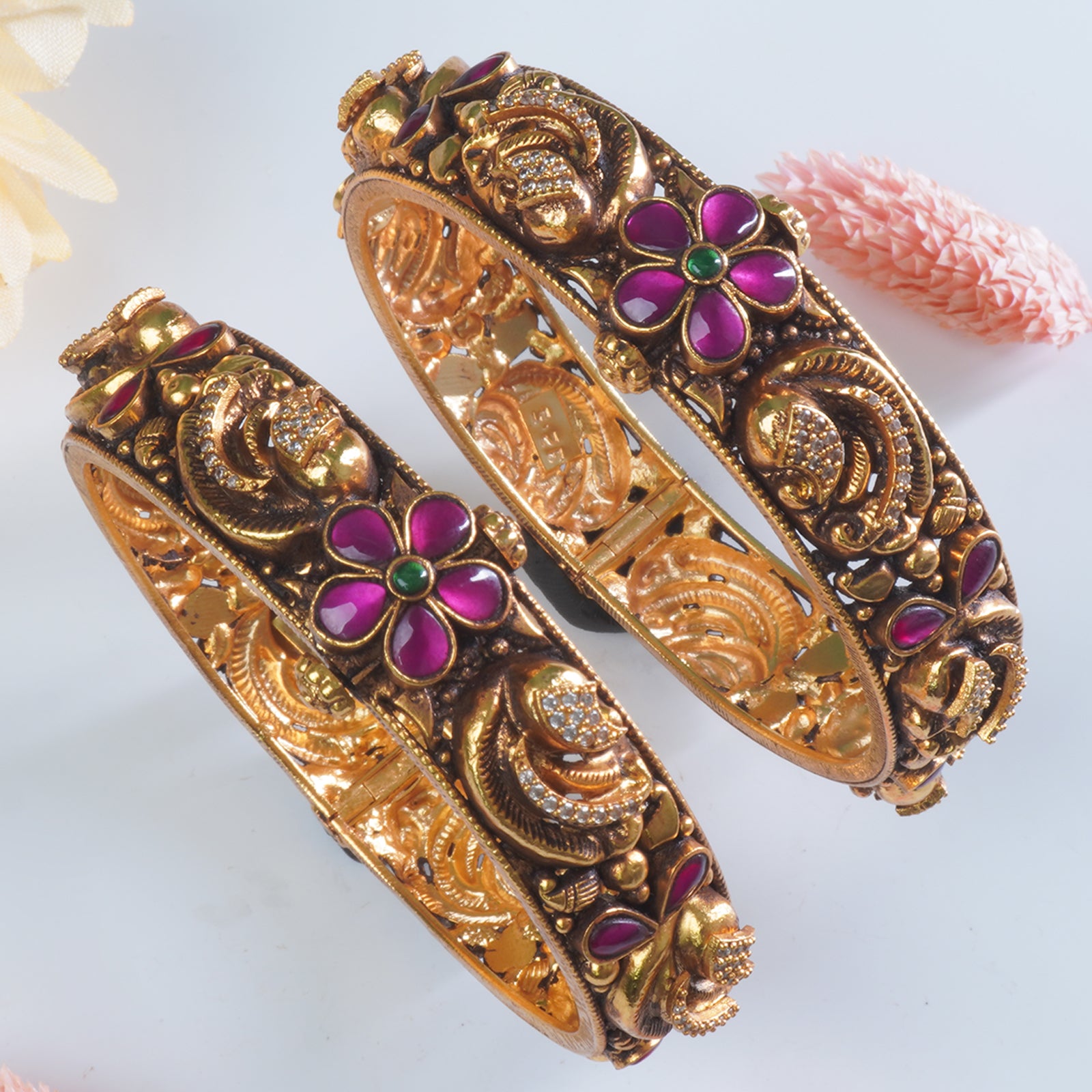 Close-up of Nakashi temple design on 925 silver gold plated bangles
