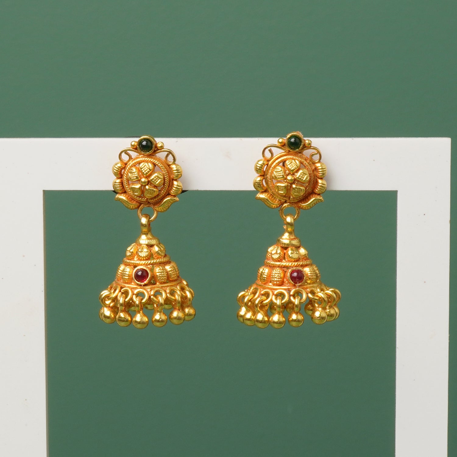 Close-up of gheru finish gold like detailing on 925 silver jhumki
