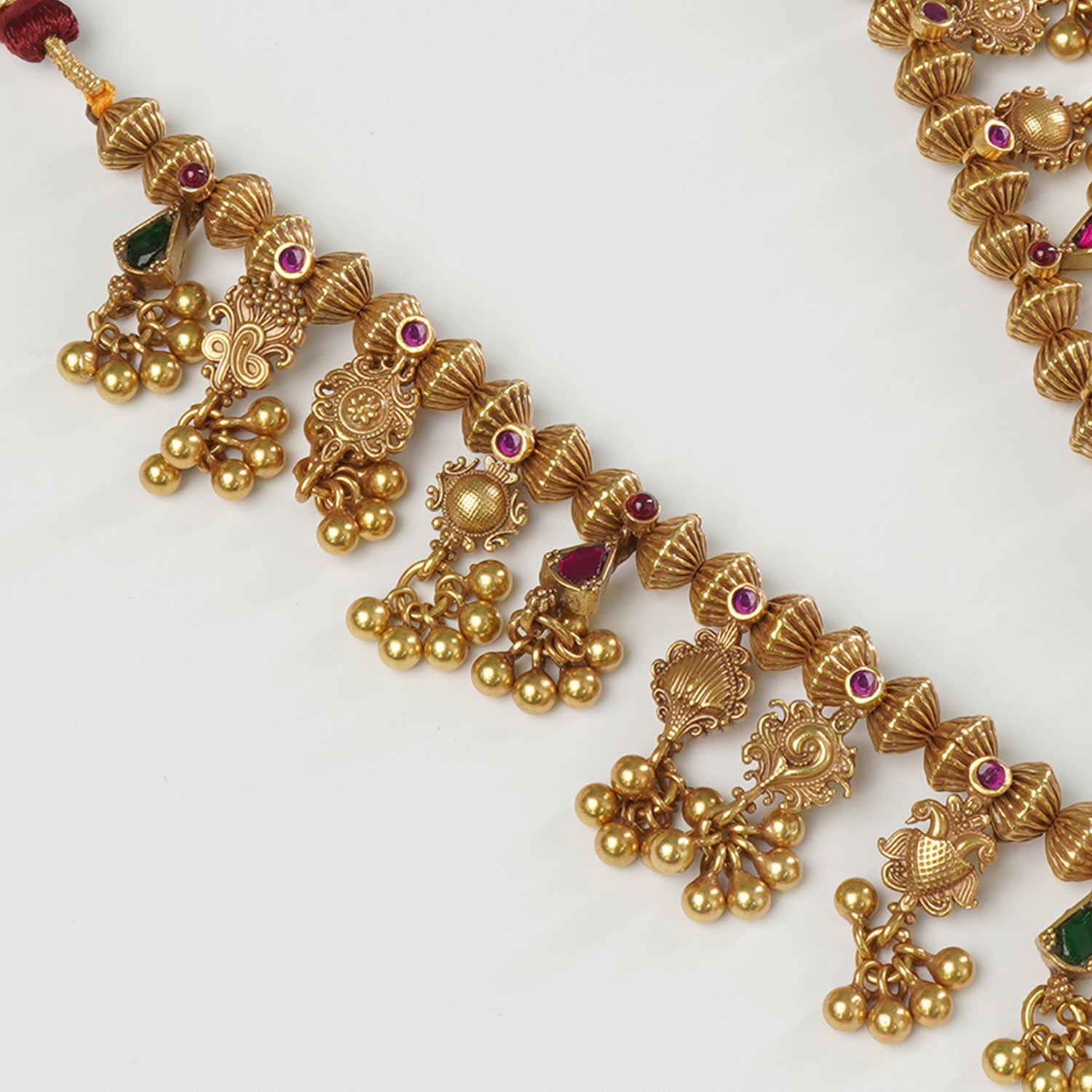 Close-up of handcrafted Javmani beads on antique gold-plated 925 silver Kolhapuri Saaj