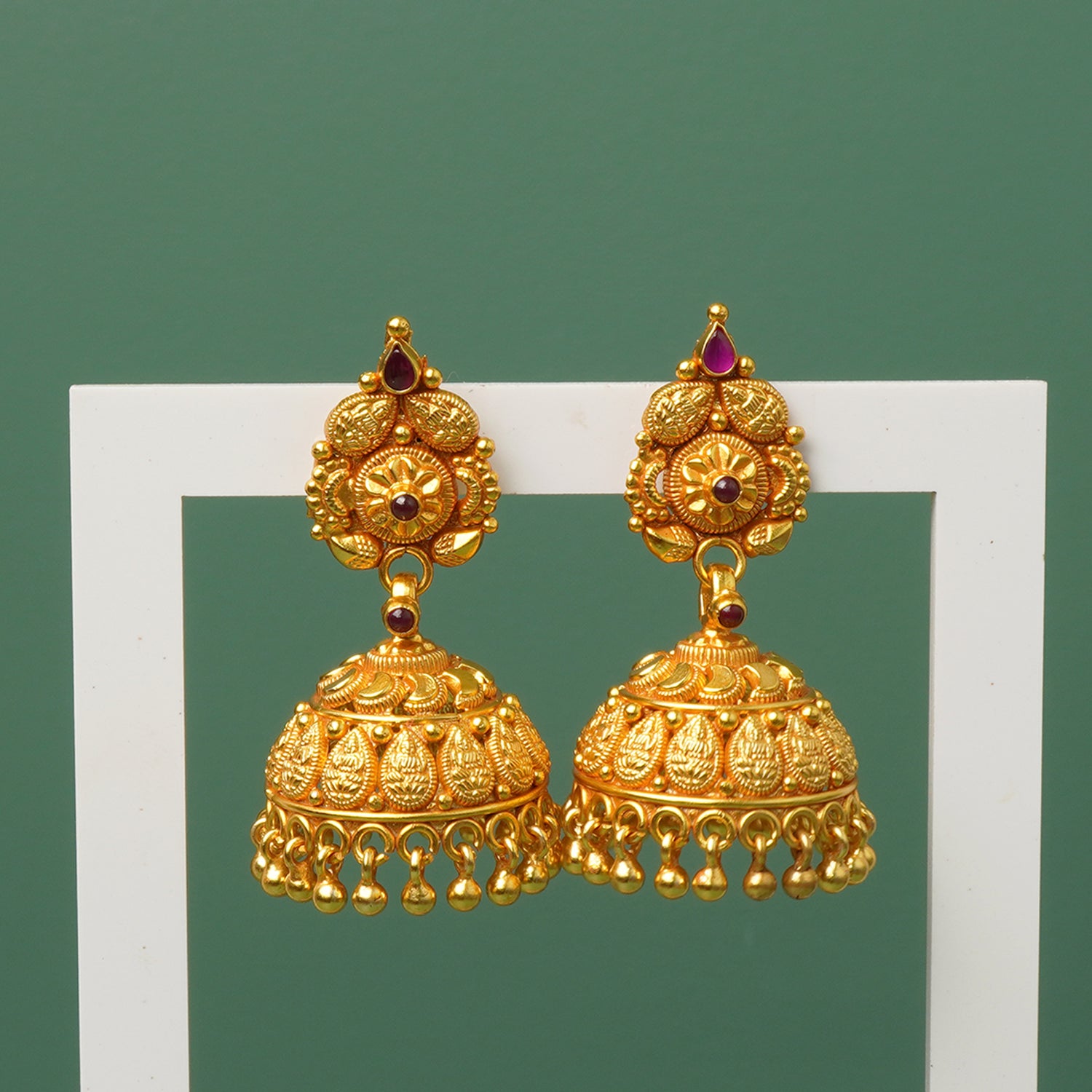 Gold jhumka in silver with temple kemp detailing