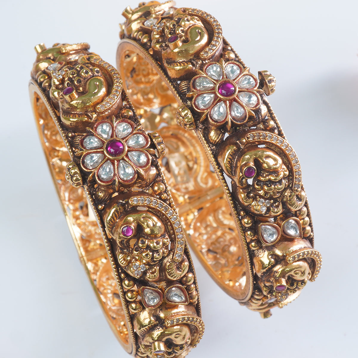 Intricate Nakshi carving on 925 silver gold plated bangles
