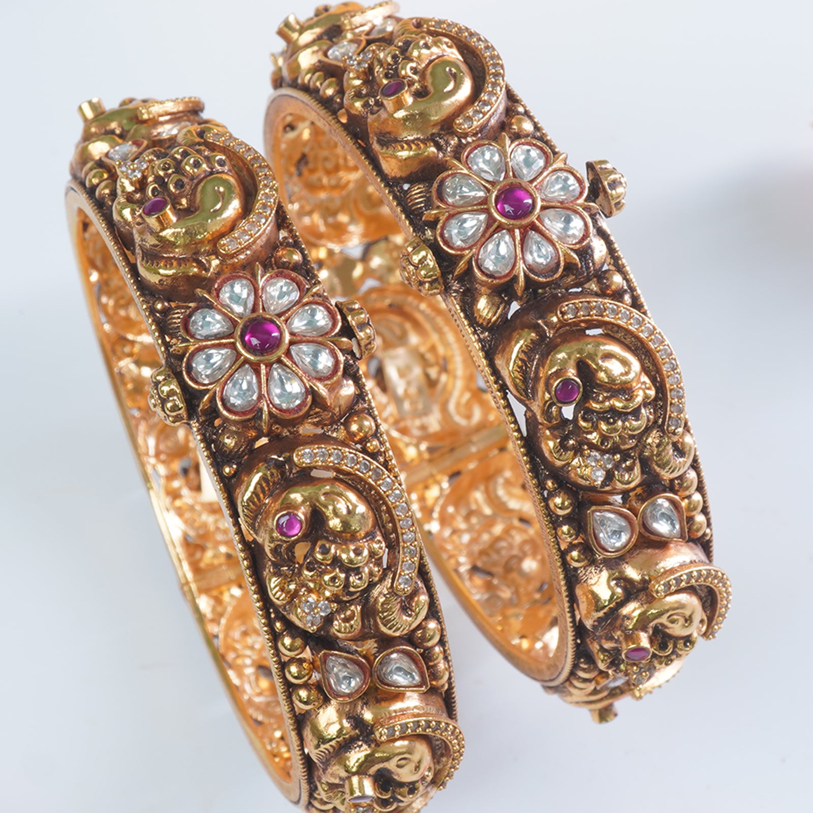 Intricate Nakshi carving on 925 silver gold plated bangles

