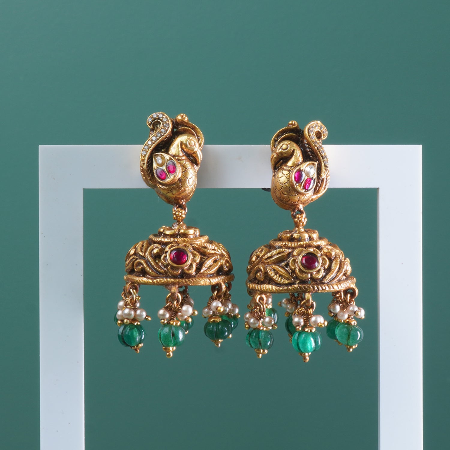 Nakashi Kundan peacock detailing in silver Nagas jhumki