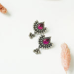 Pure silver oxidised Paan shaped earrings with red Kemp Stone