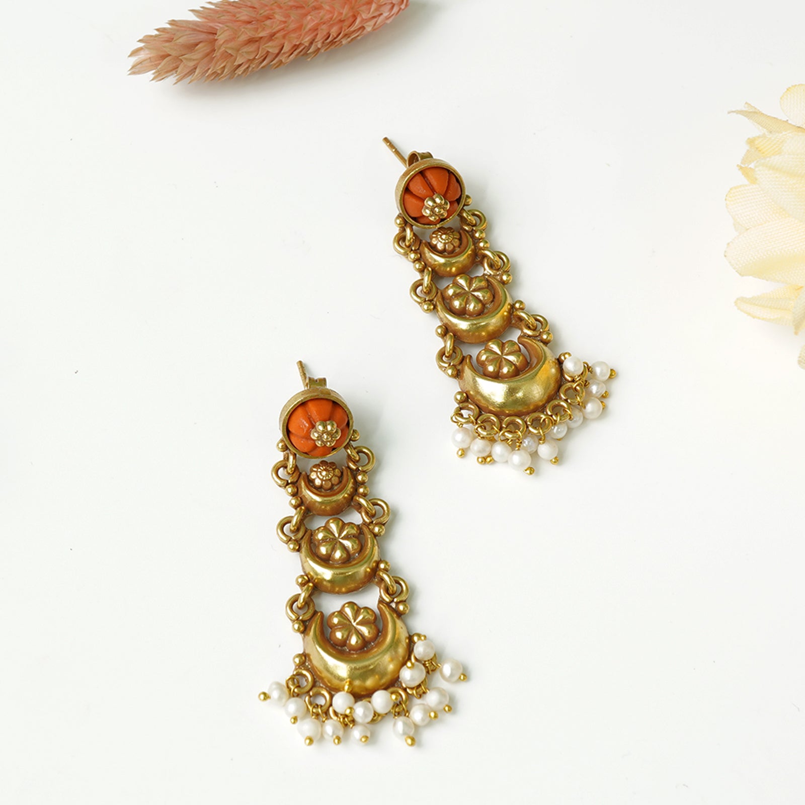 Silver earrings studded with corals and antique gold plating