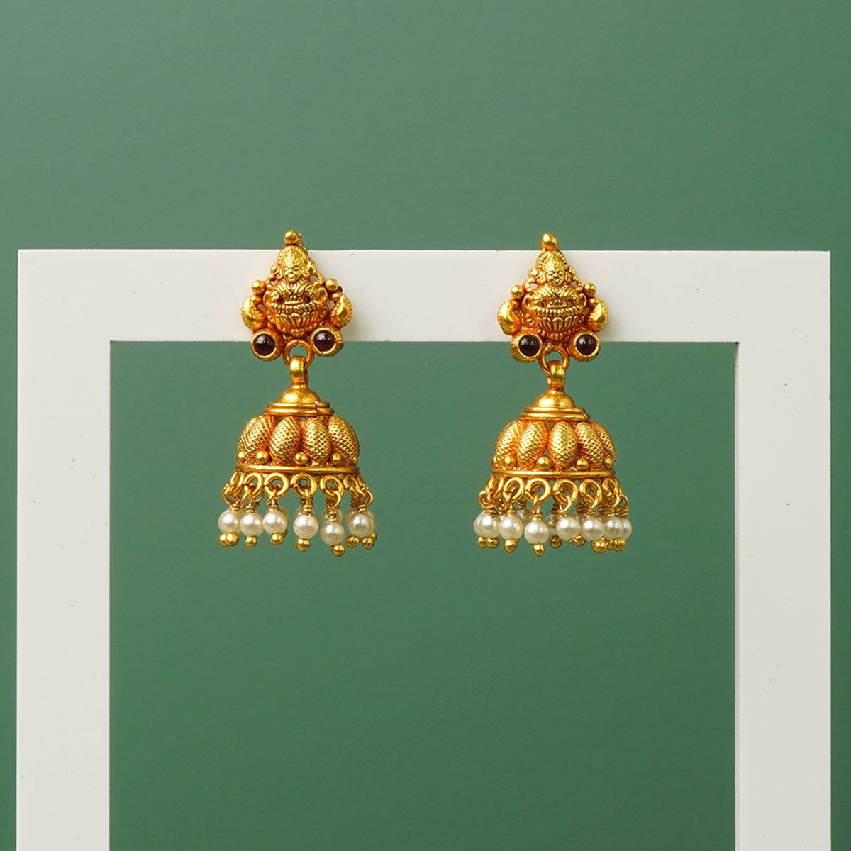 Silver jhumkas with pearls and gold plated detail