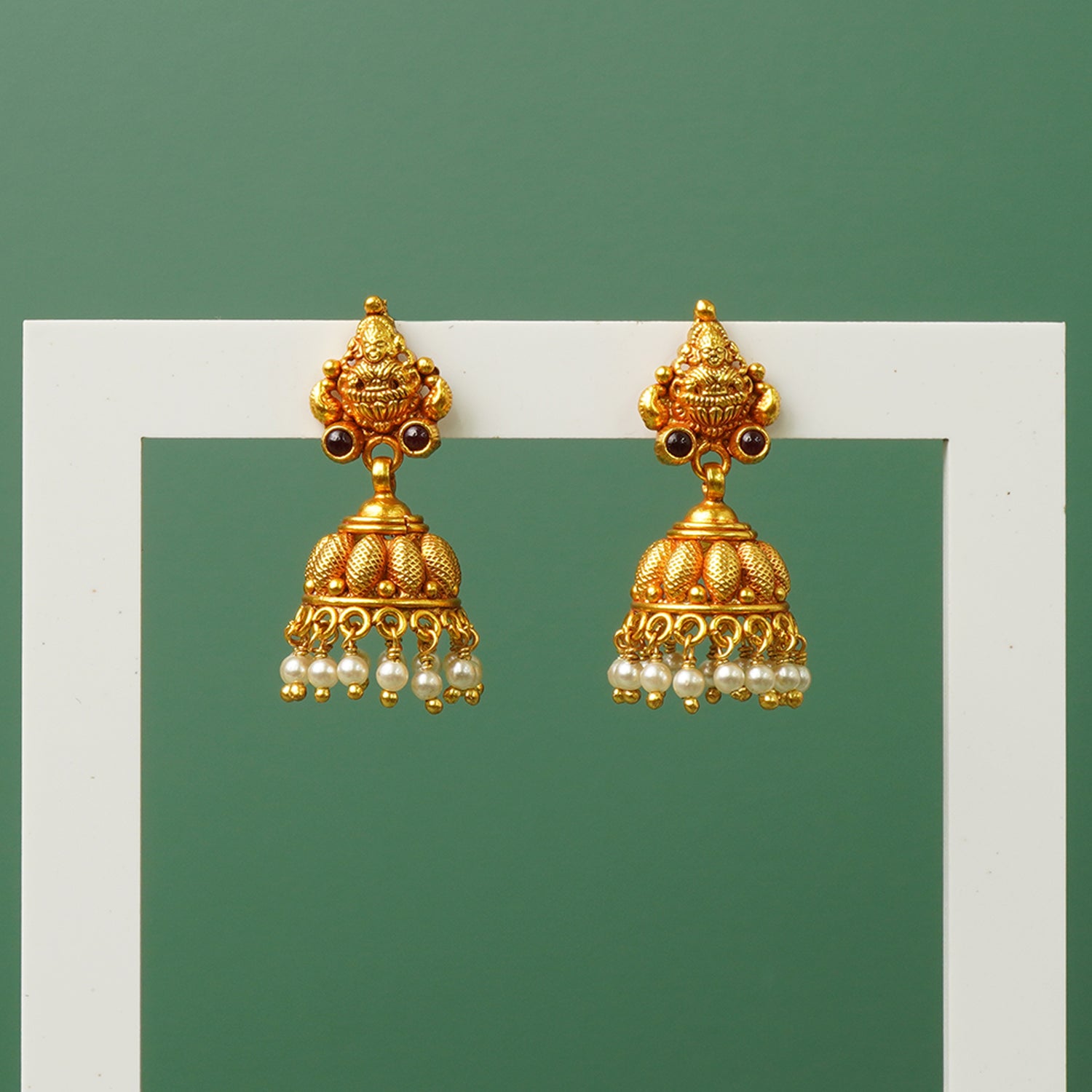 Silver jhumkas with pearls and gold plated detail