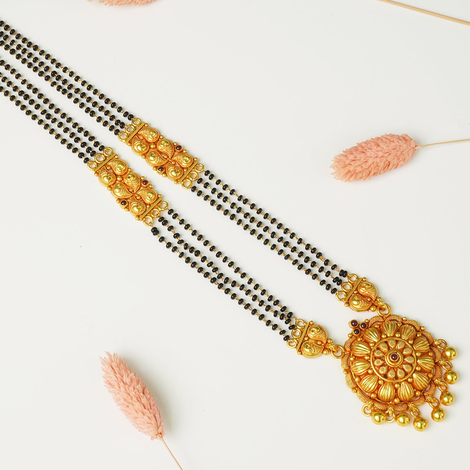 Silver mangalsutra that looks like gold detail