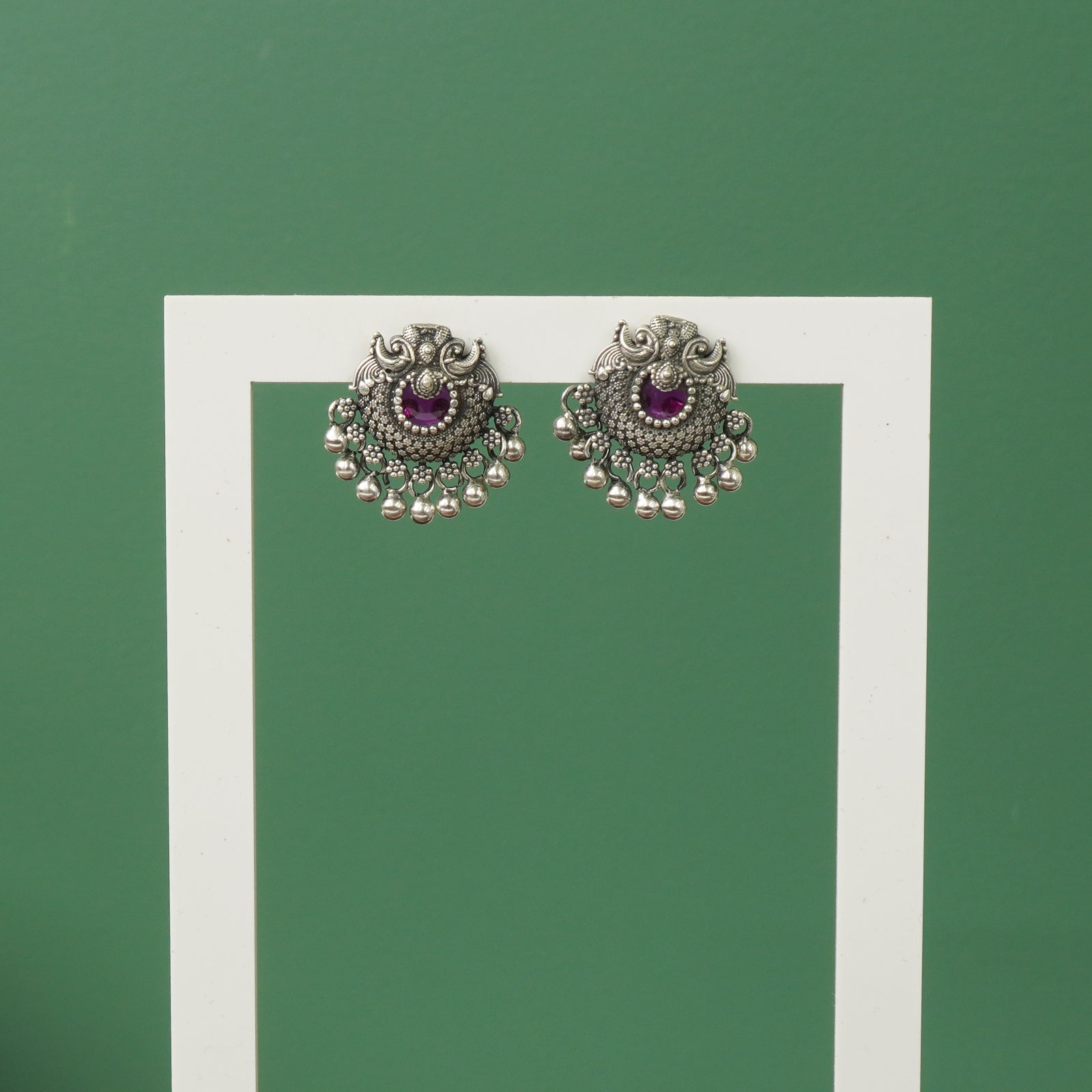 Silver oxidised Peacock earrings with red stones and Ghungroos