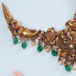 Temple silver necklace in gold plated finish nagas work