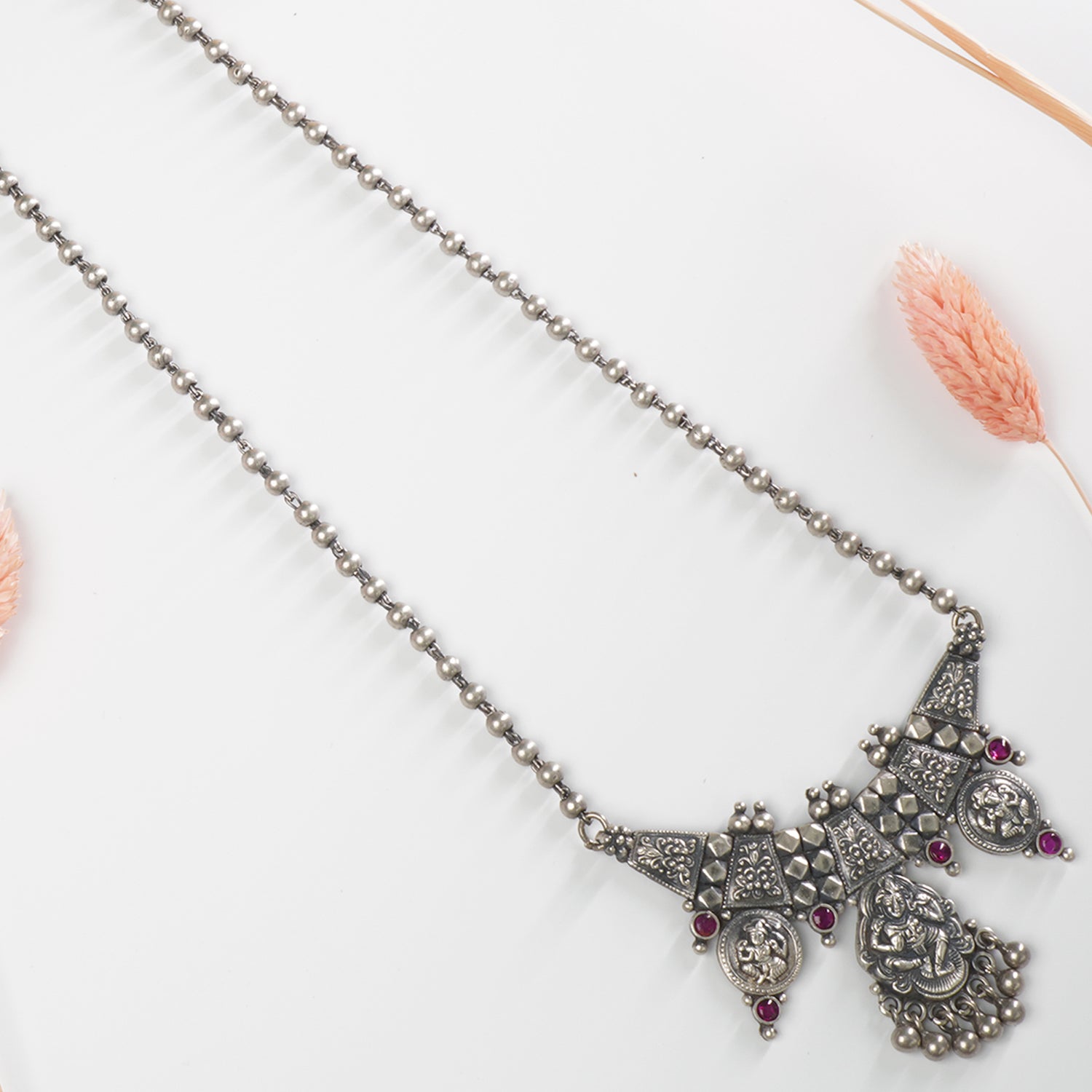 Close-up of 4mm silver beads chain and gold look jointing piece pendant in 925 silver necklace
