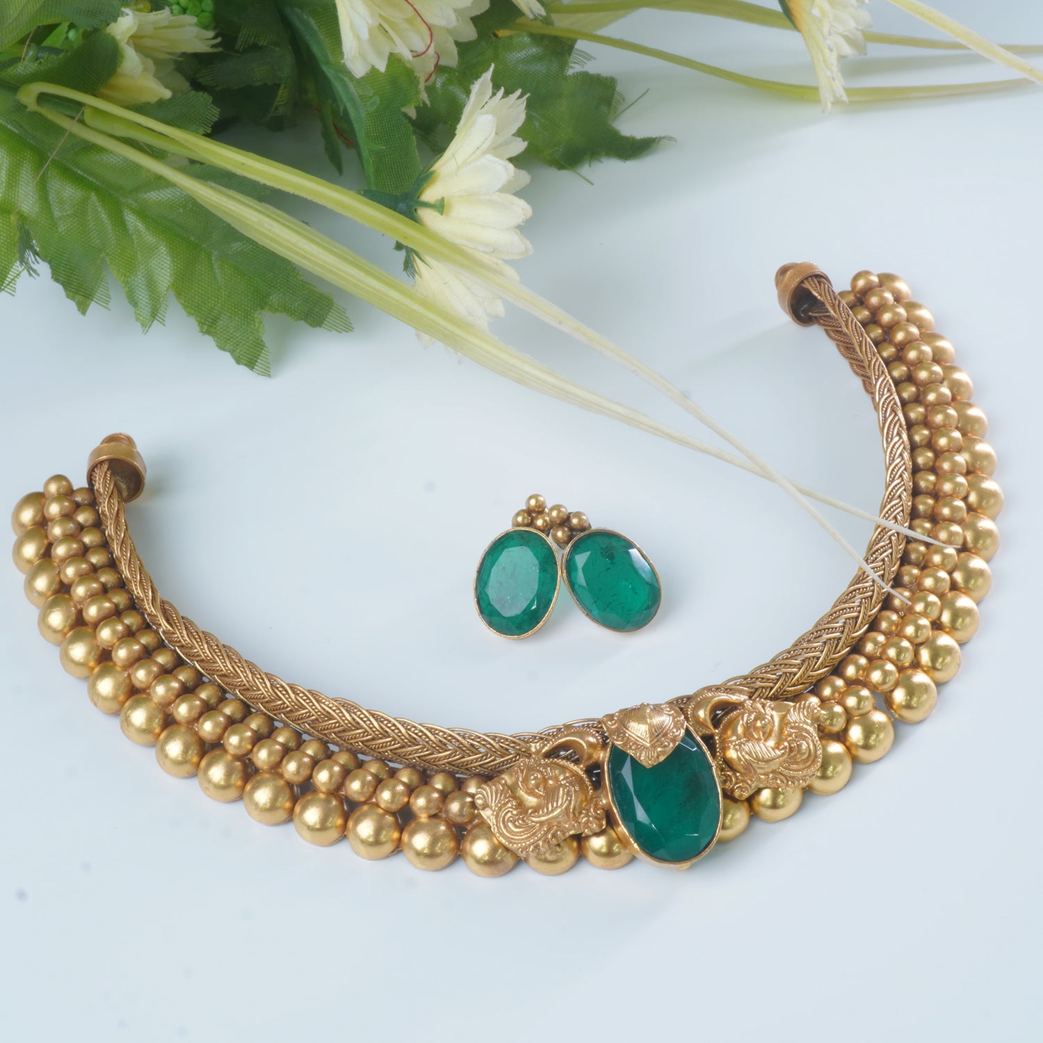 An elegant gold plated silver necklace with green stone