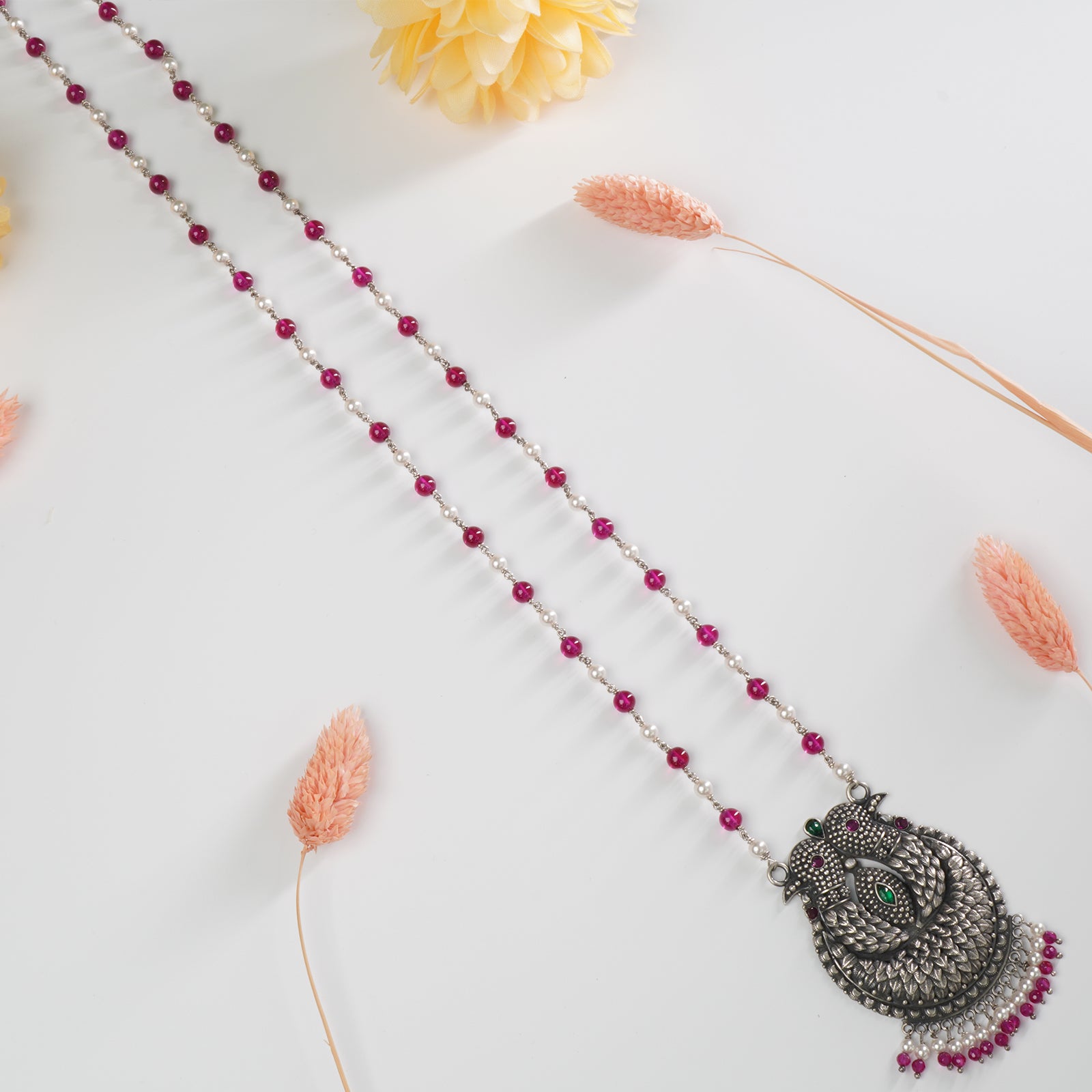 long silver necklace with handoven pearl and red beads