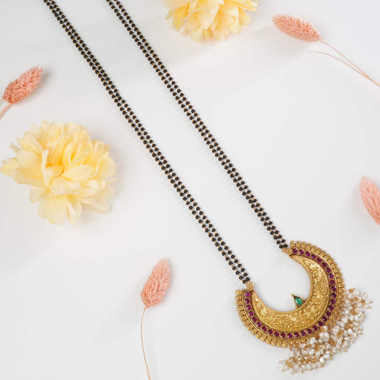 Pure silver gold plated mangalsutra design with handmade pearl studded silver pendant.