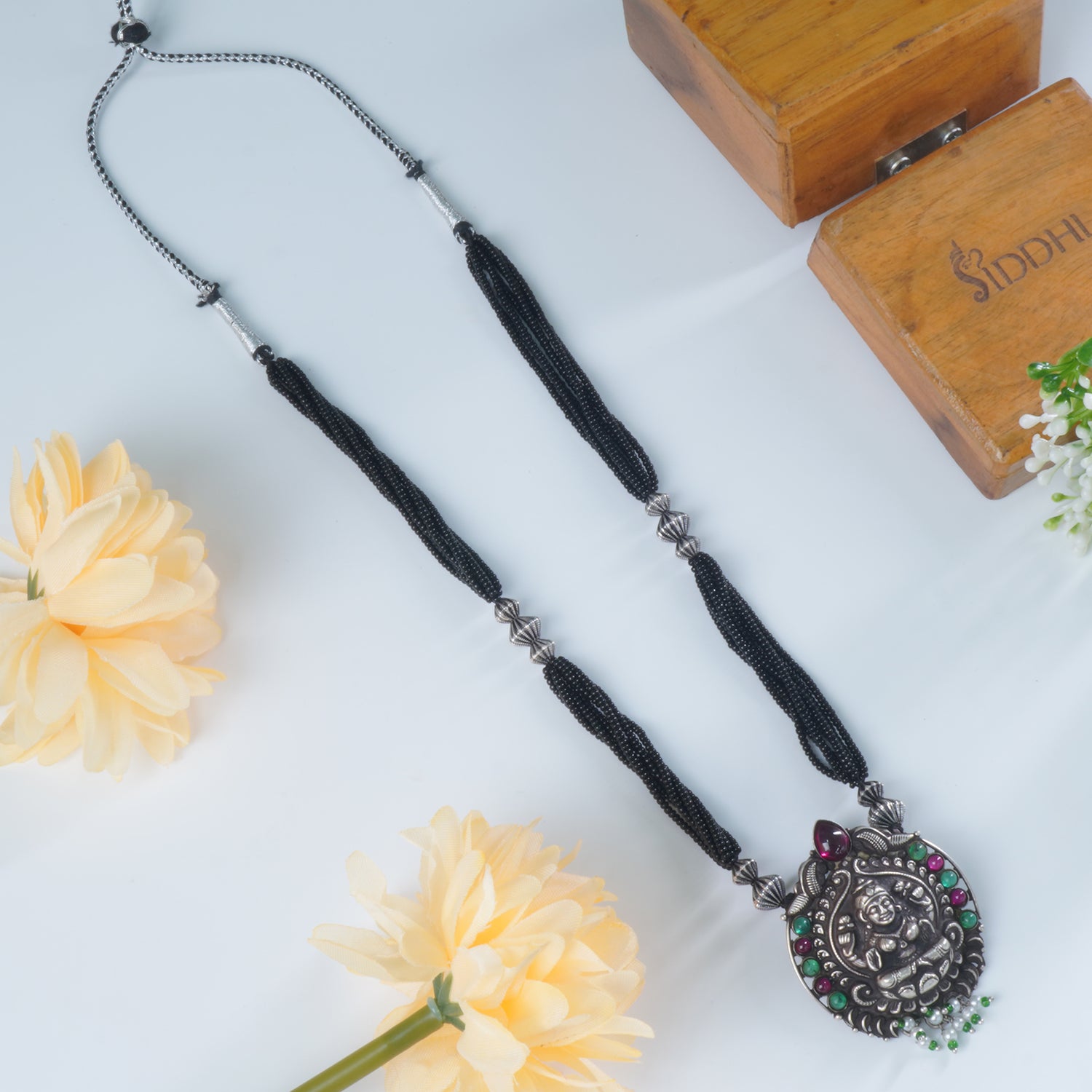 Buy Black Beads Silver Mangalsutra Design With HandCarved Pendant Design