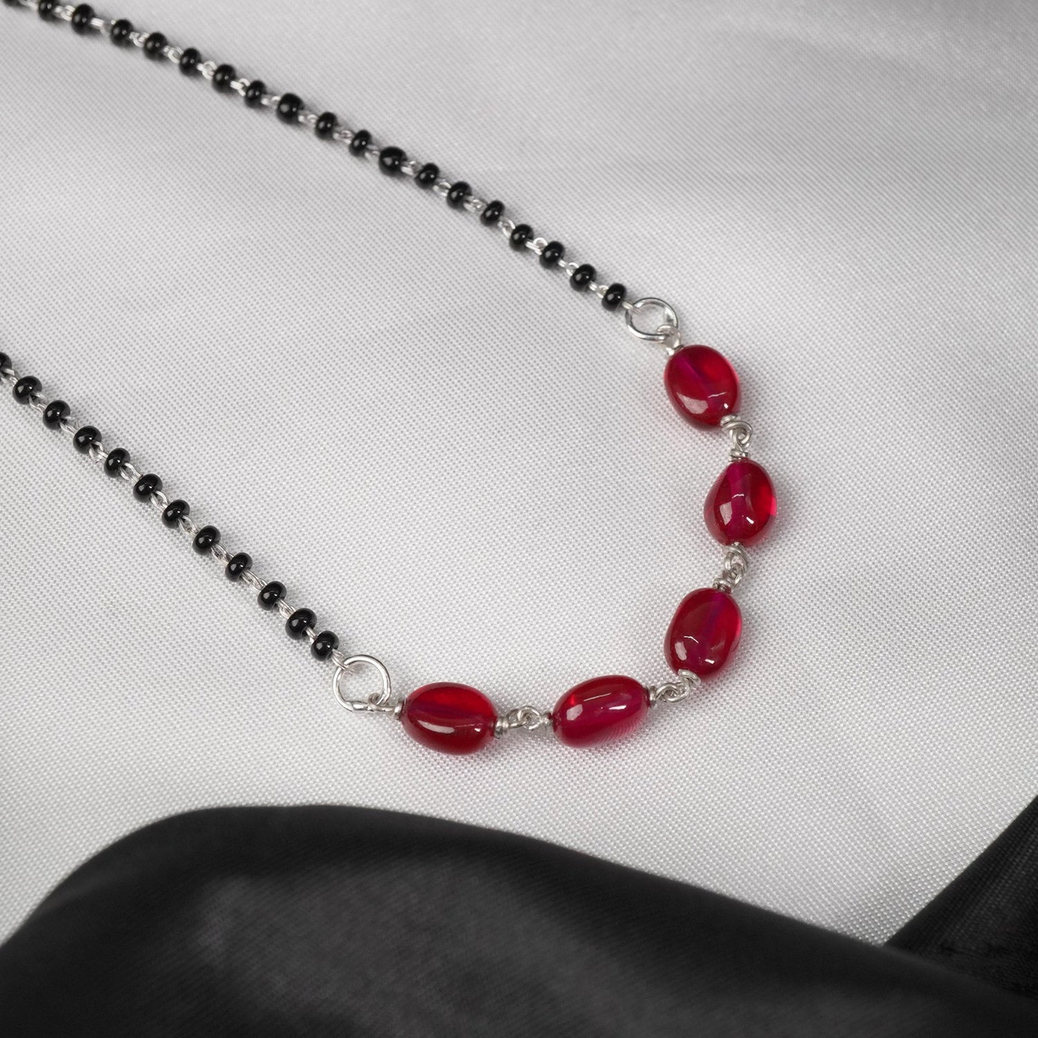 minimal silver mangalsutra with red oval beads