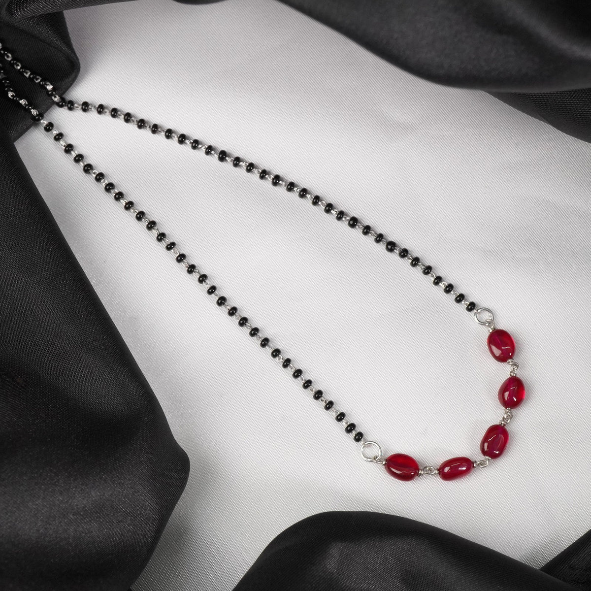 minimal silver mangalsutra with red oval beads