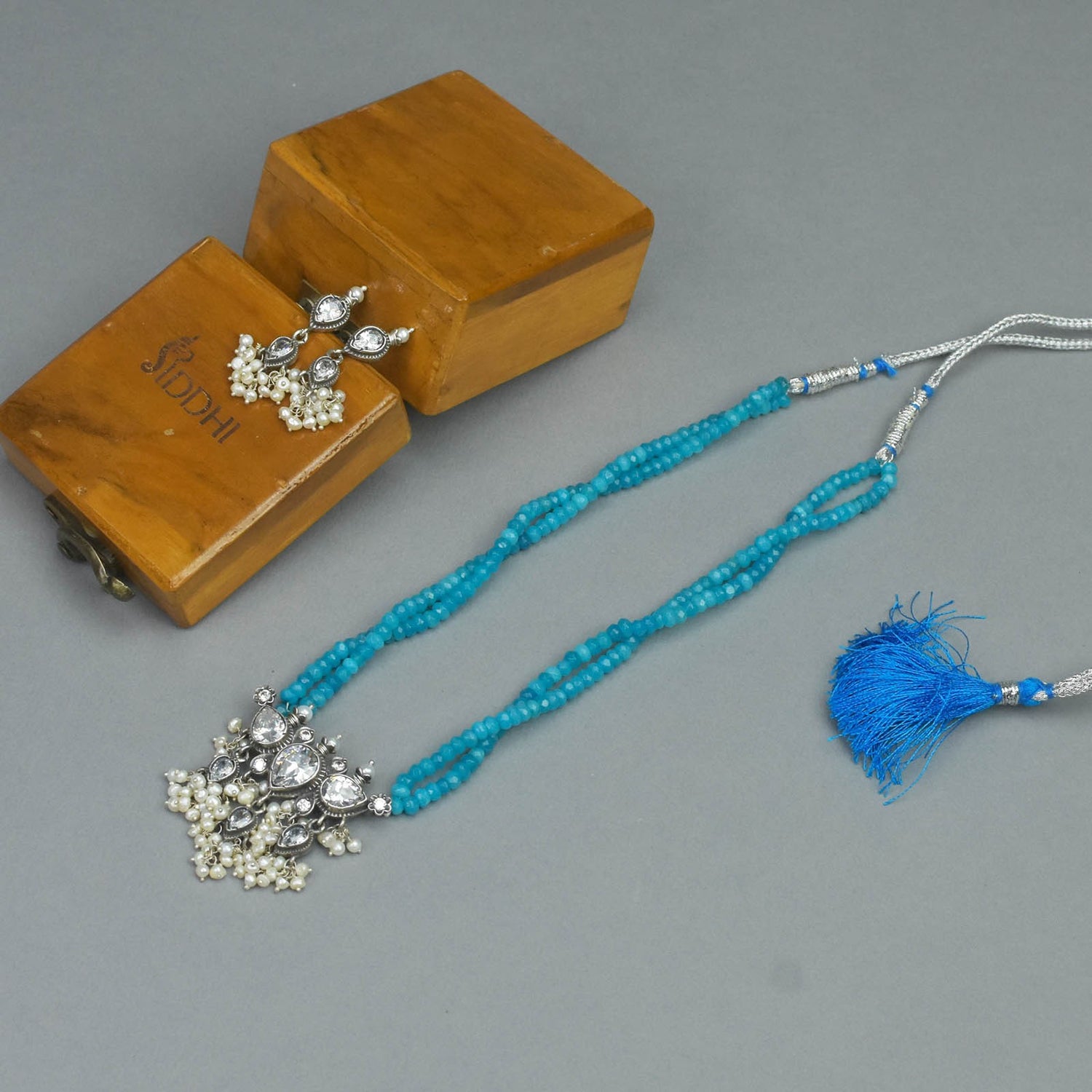 blue crystal silver tanmani necklace design.