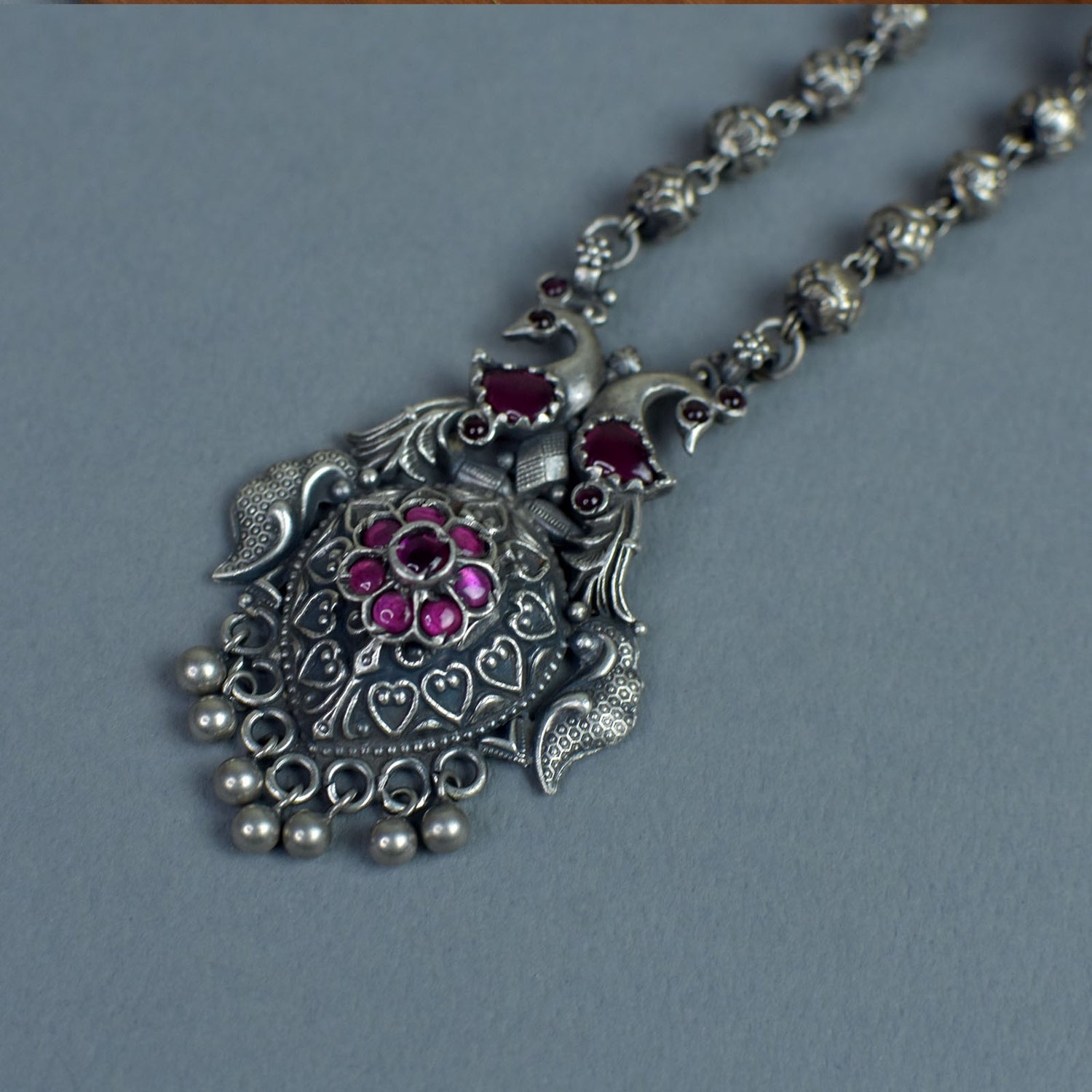 silver peacock pendant with kemp stones