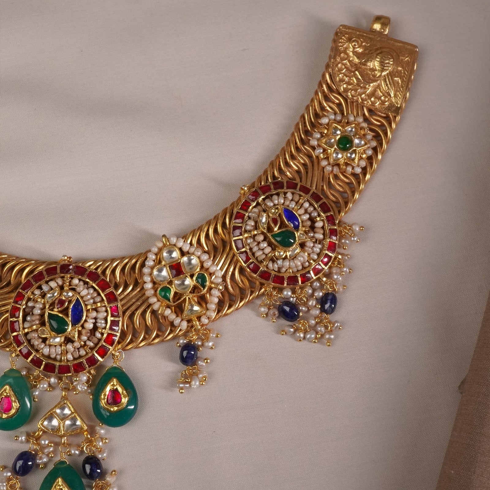 a peacock shaped kundan piece