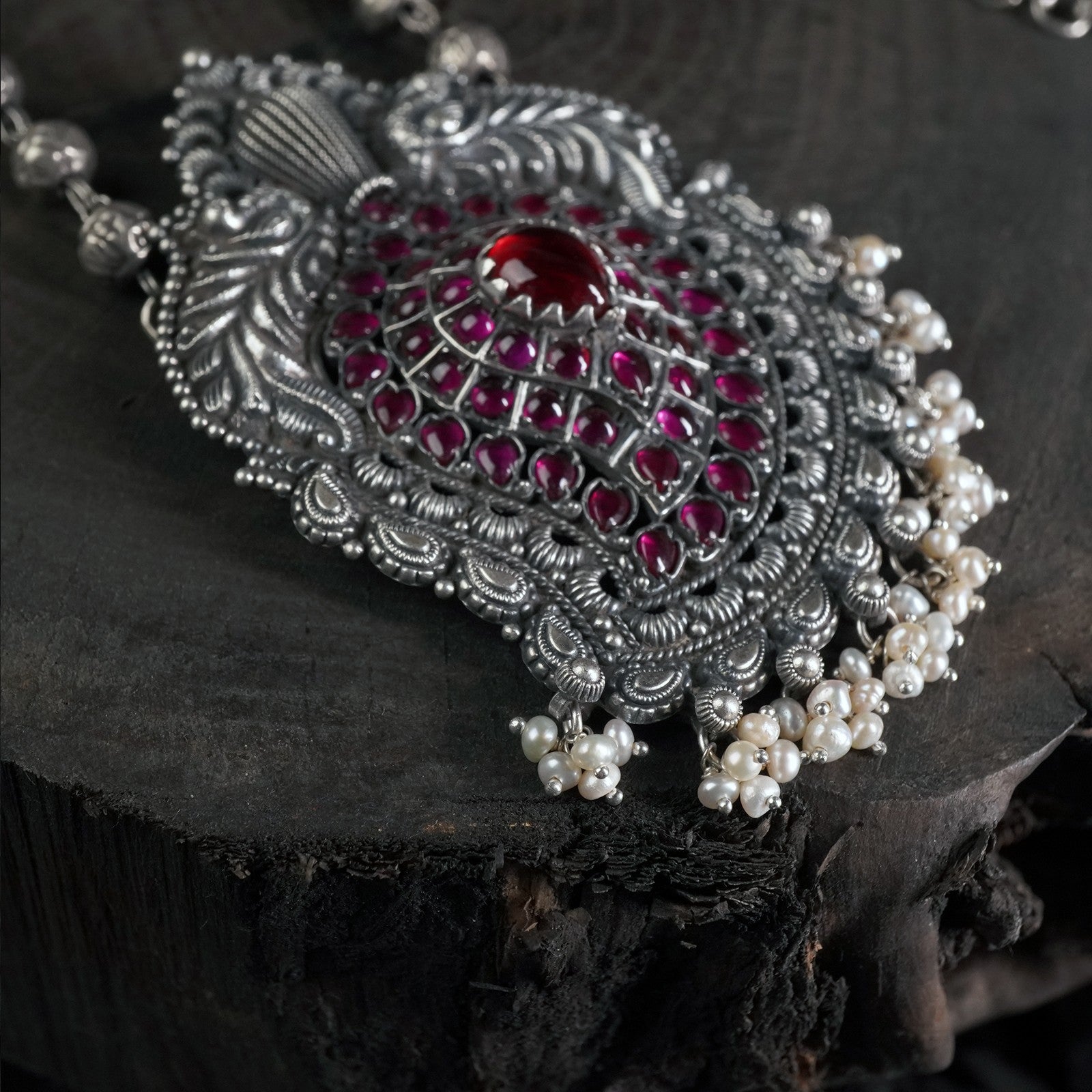 silver peacock pendant with red kemp stones