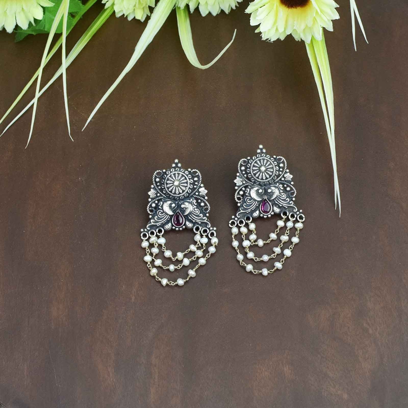 silver jhumka peacock design