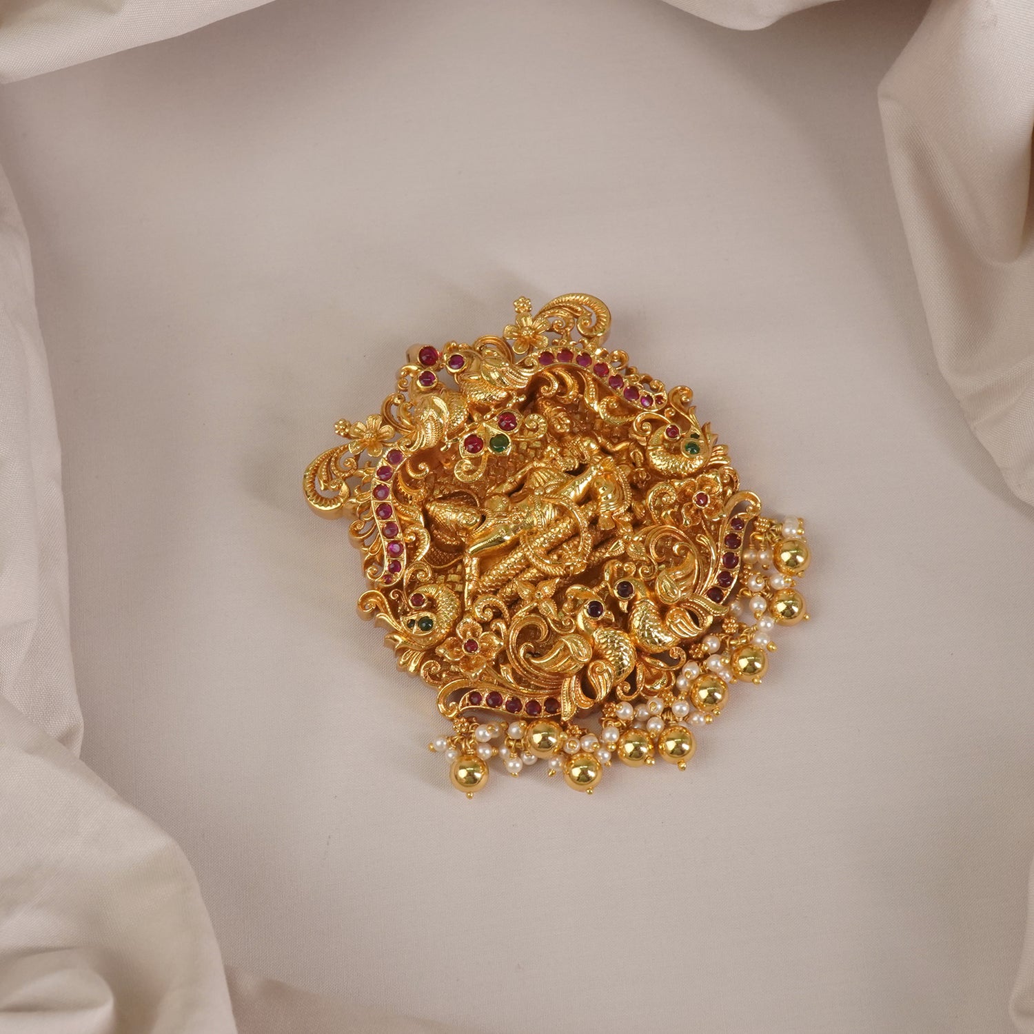 a regal silver pendant with gold plating