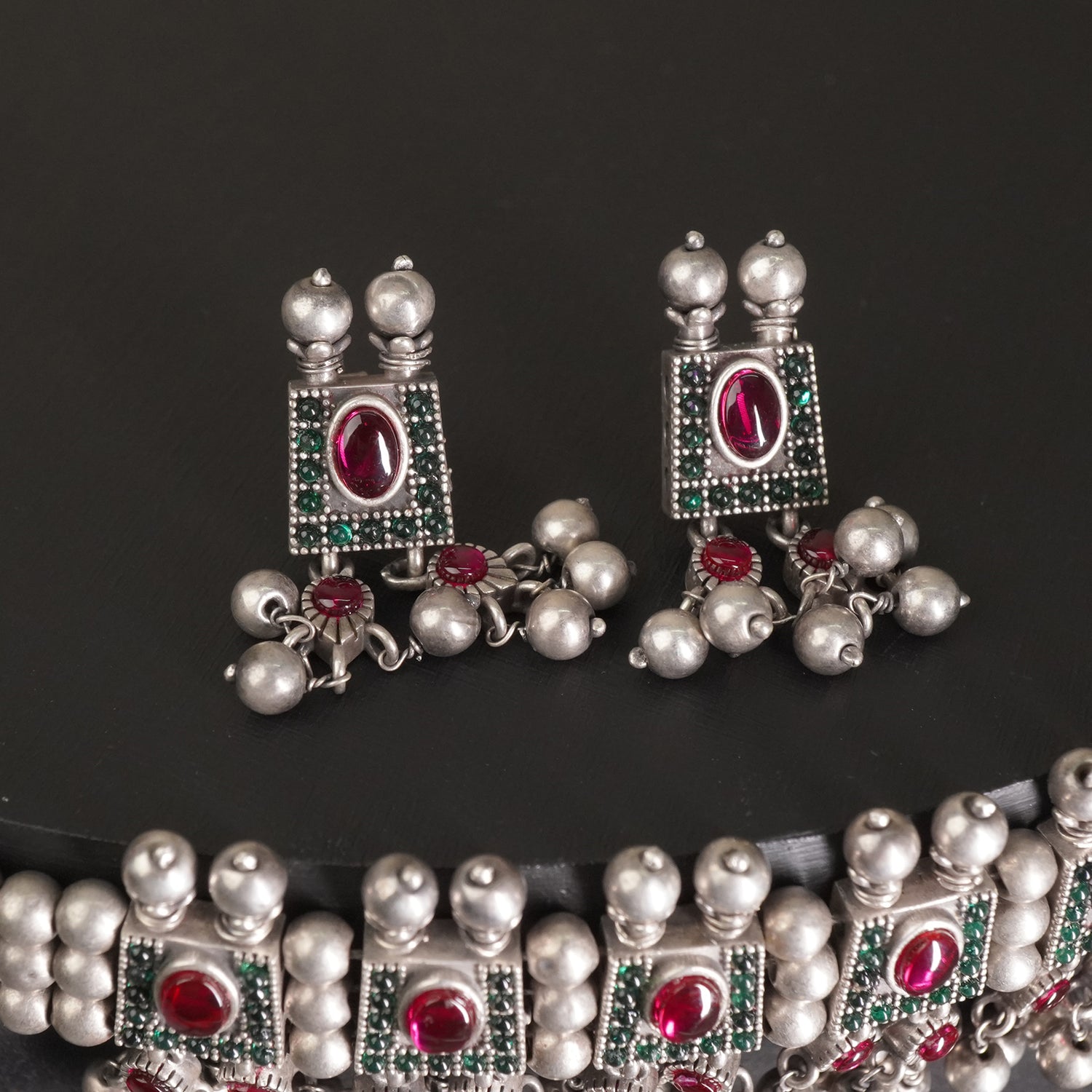 a silver chinchpeti earrings design with silver beads