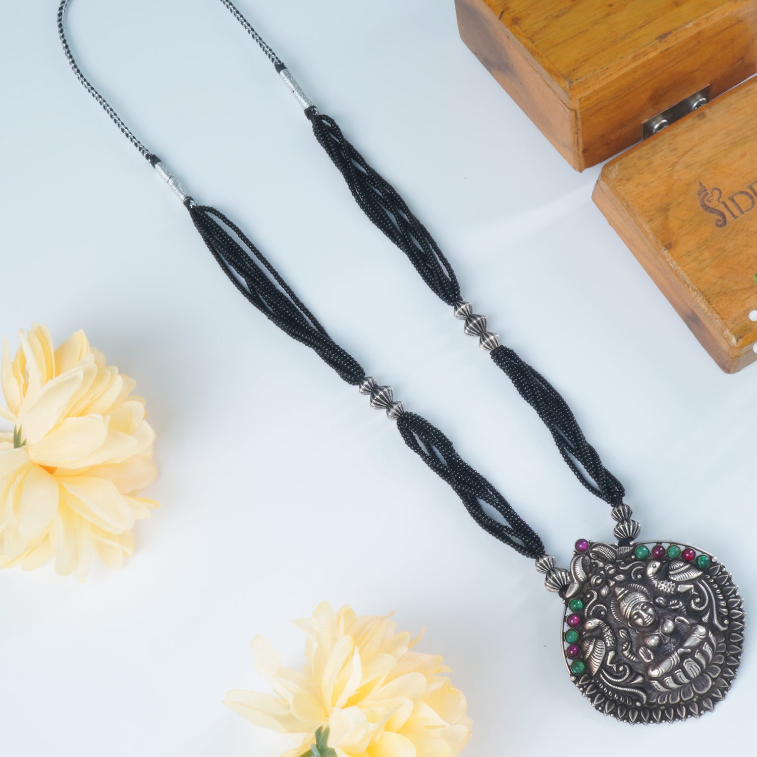 Shop Black Beads Silver Mangalsutra Design With HandCarved Pendant