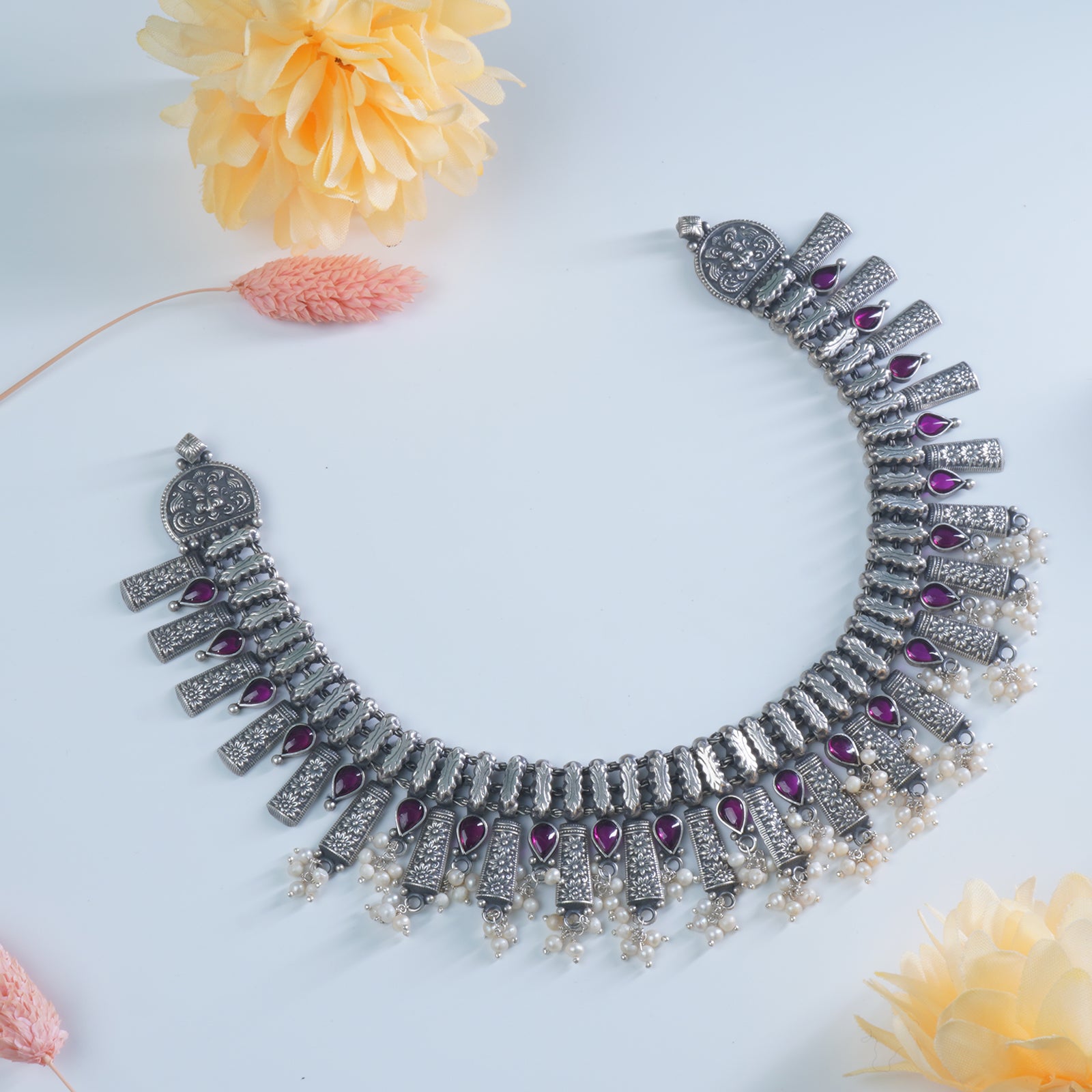 an impressive 925 silver necklace design studded with kemp stones and freshwater pearls