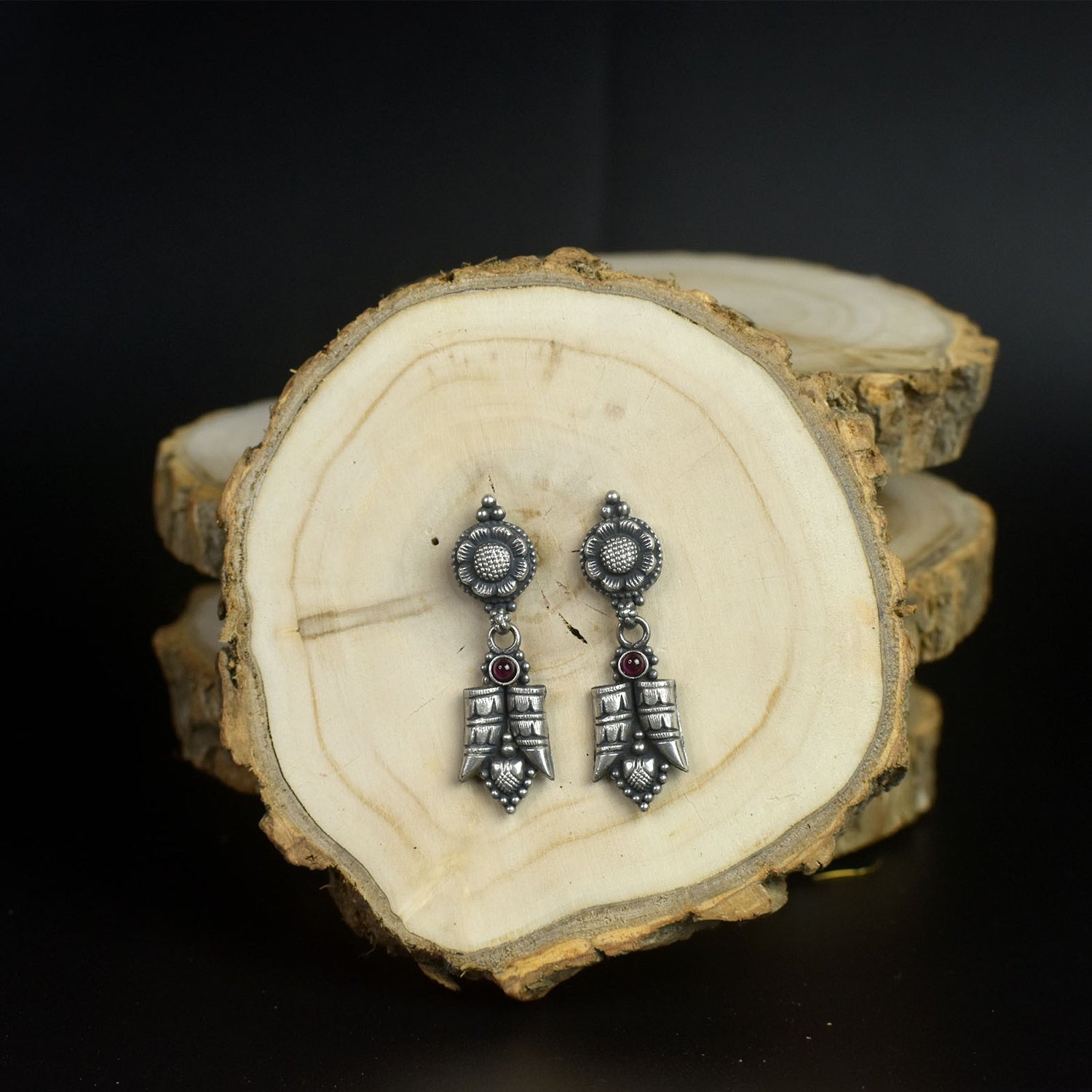 small silver earrings.