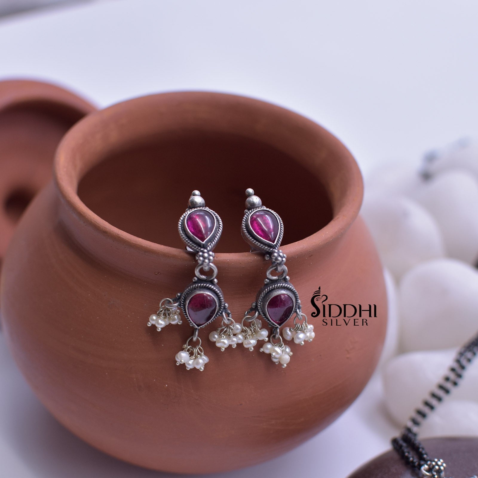 Silver tanmani earrings